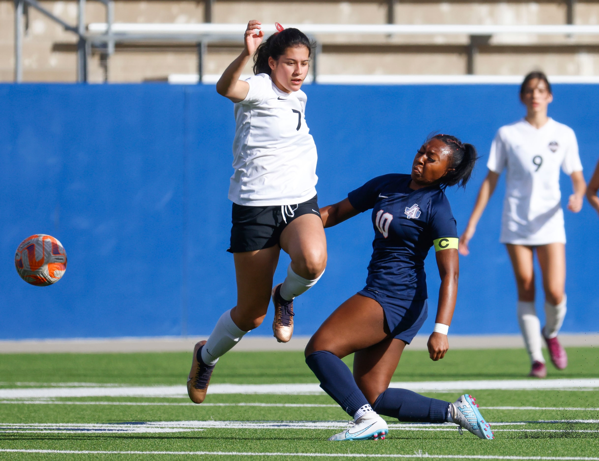 Marcus’s Bella Campos (left) doges a tackle by Allen’s Melania Fullerton during the first...