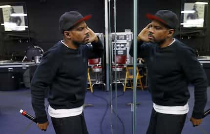 Gospel superstar Kirk Franklin uses the mirror wall to practice his show performance during...