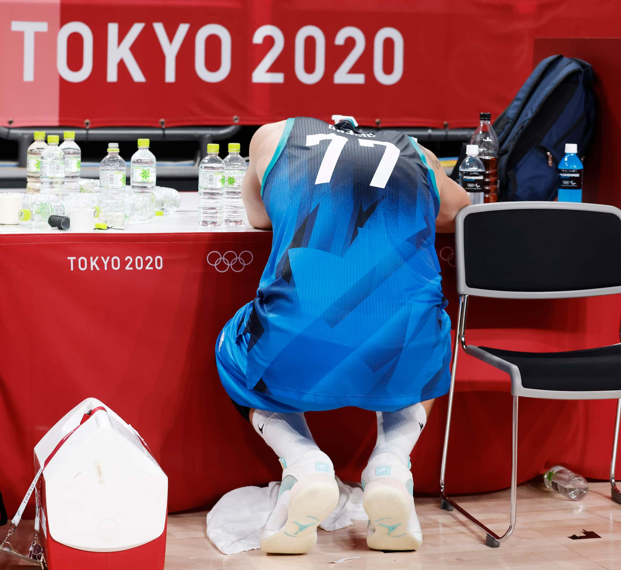 Slovenia’s Luka Doncic (77) sits dejected after losing to France 90-89 in a men’s basketball...