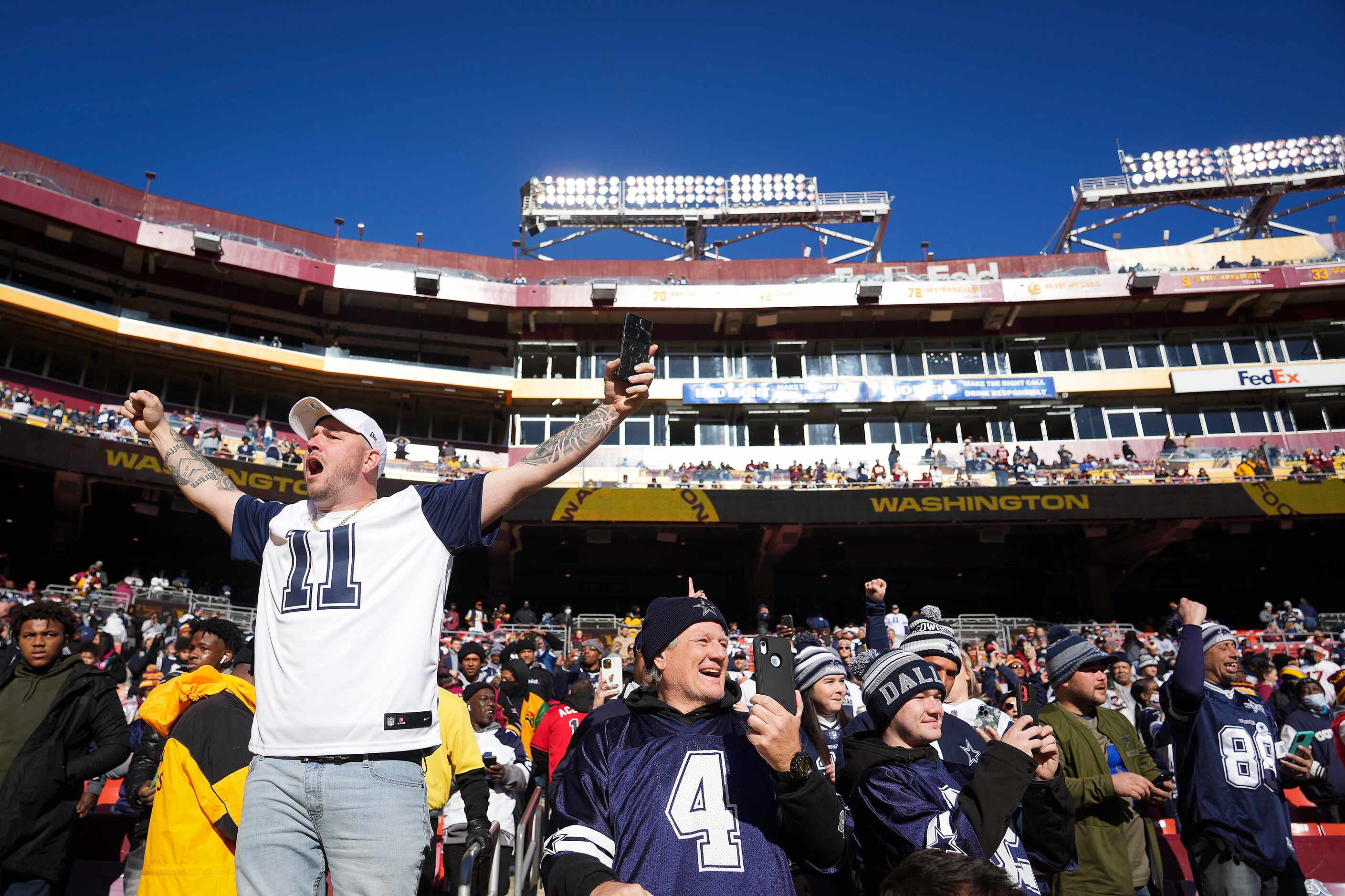 Dallas Cowboys fans cheer their team before an NFL football game against the Washington...