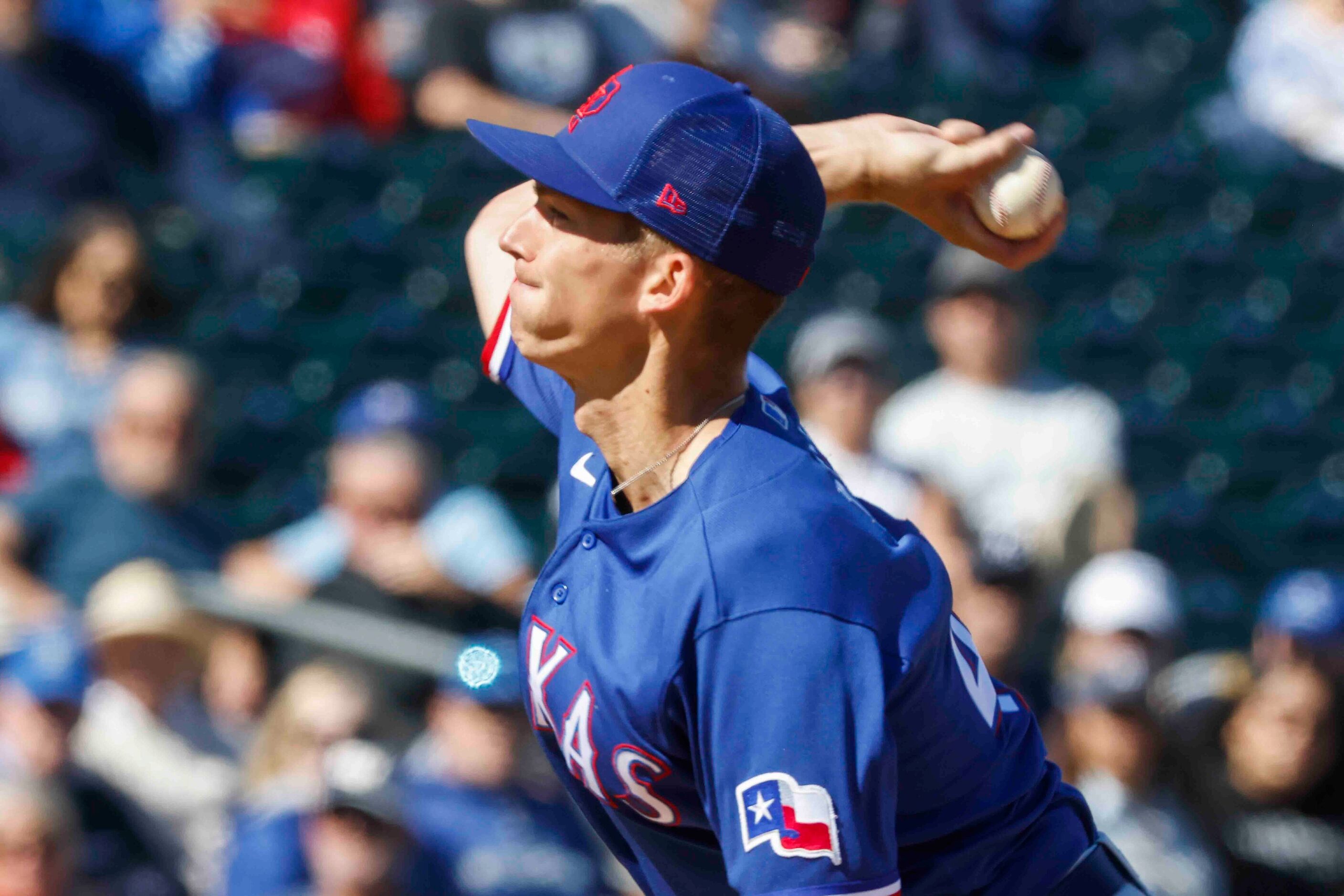 Texas Rangers Glenn Otto pitches during the first inning of a spring training game against...