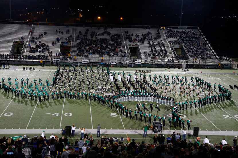 The Southlake Carroll band forms the State of Texas at halftime against Wylie, during a high...