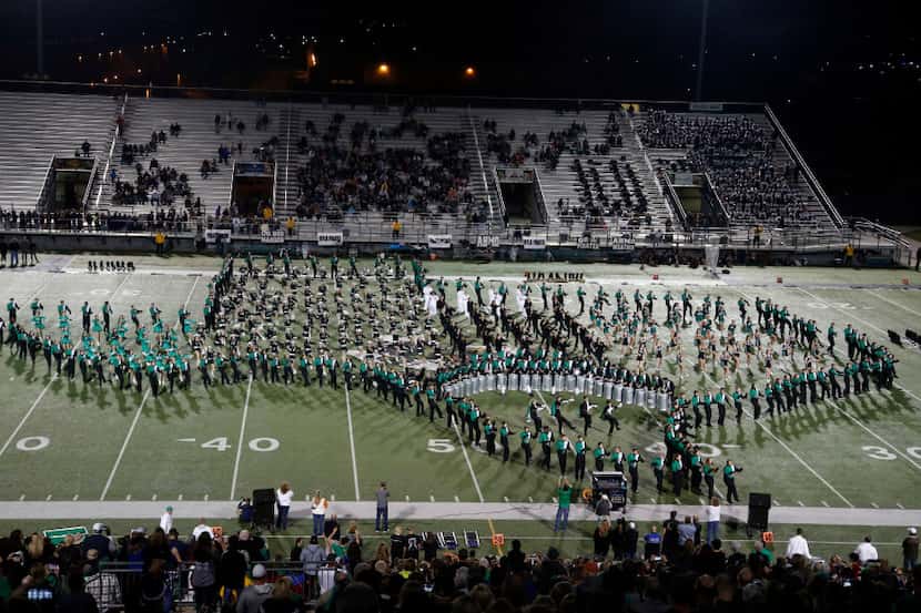 The Southlake Carroll band forms the State of Texas at halftime against Wylie, during a high...
