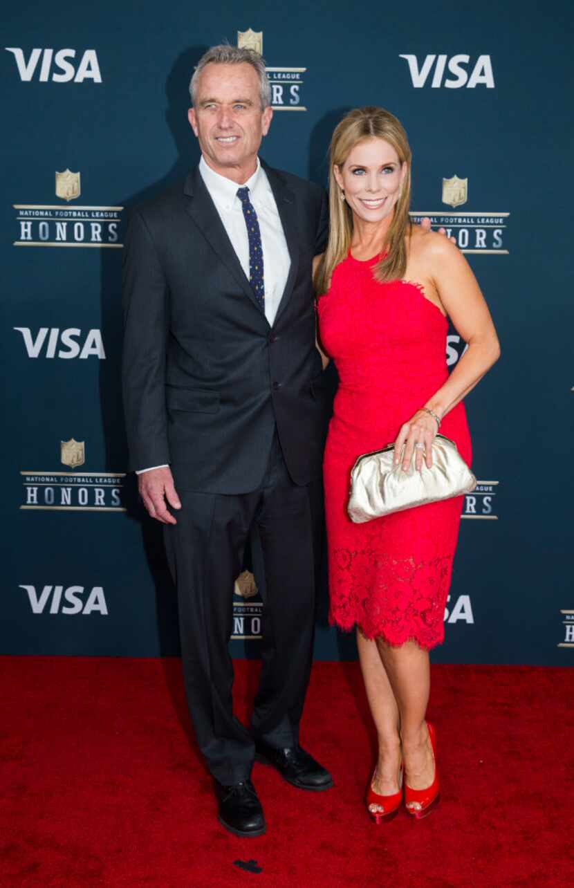 Robert F. Kennedy Jr. and actress Cheryl Hines pose for a photo on the red carpet before...