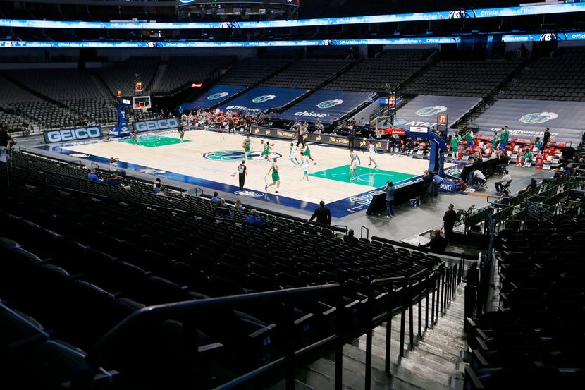 No fans allowed in the arena as the Dallas Mavericks and Charlotte Hornets play in the first...
