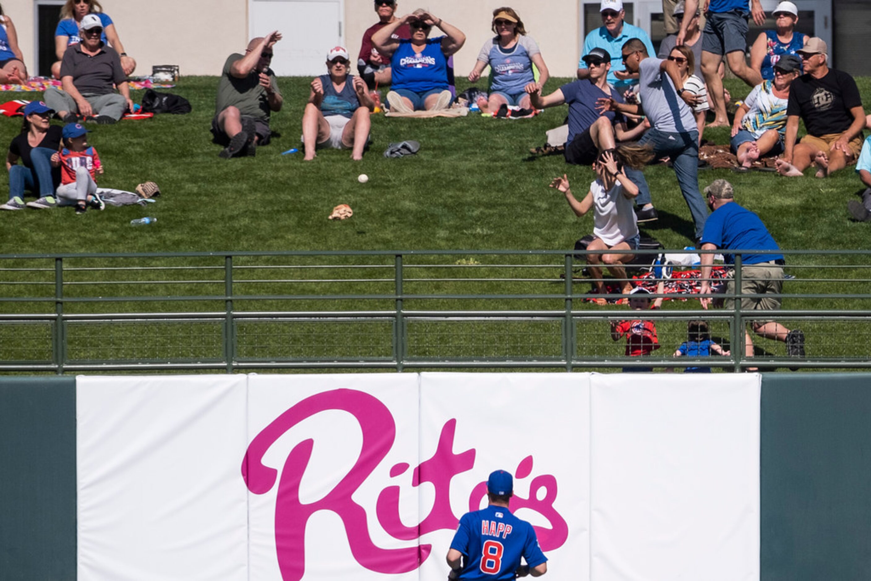 A home run off the bat of Texas Rangers first baseman Ronald Guzman lands past Chicago Cubs...