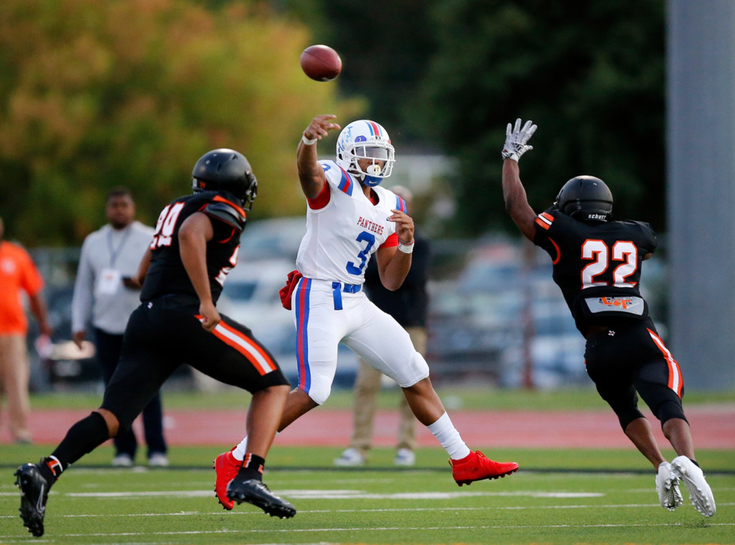 Duncanville quarterback Ja'Quinden Jackson (3) rolls out and passes against Lancaster during...