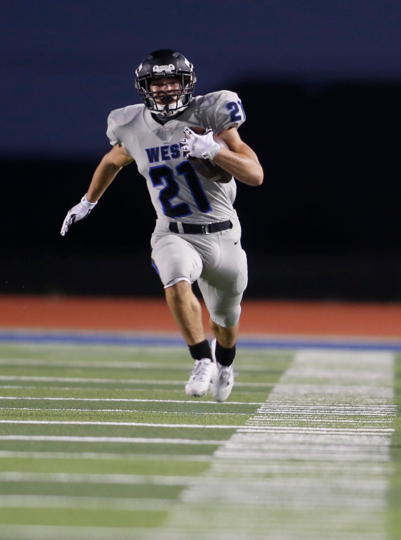 Plano West running back Dermot White(21) had the sidelines to himself after turning a swing...