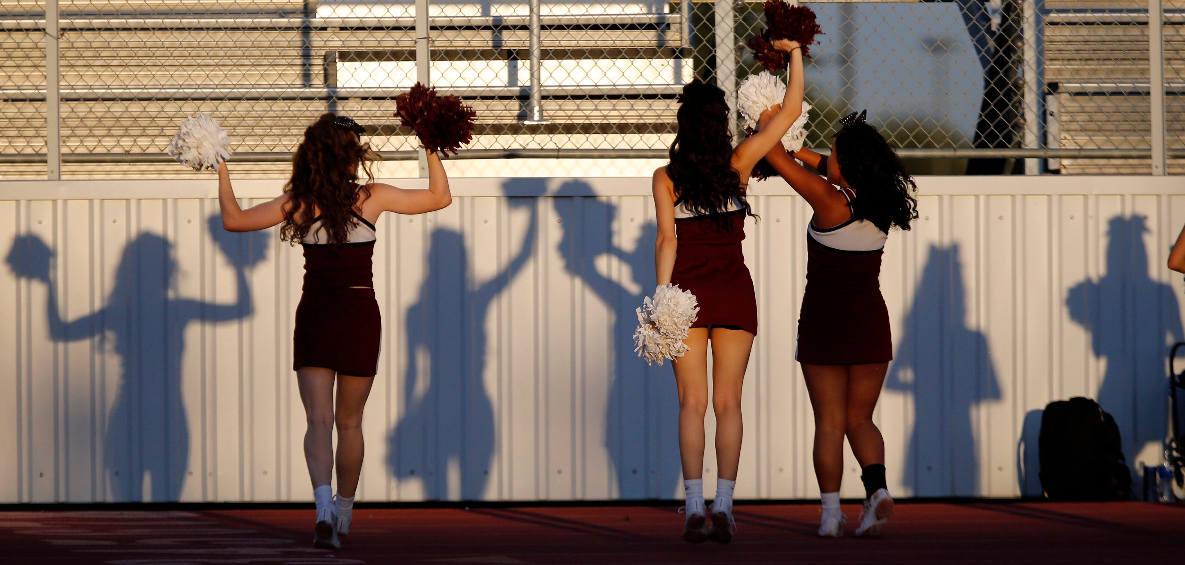 Wylie High cheerleaders and there shadows perform a routine during the first half a high...