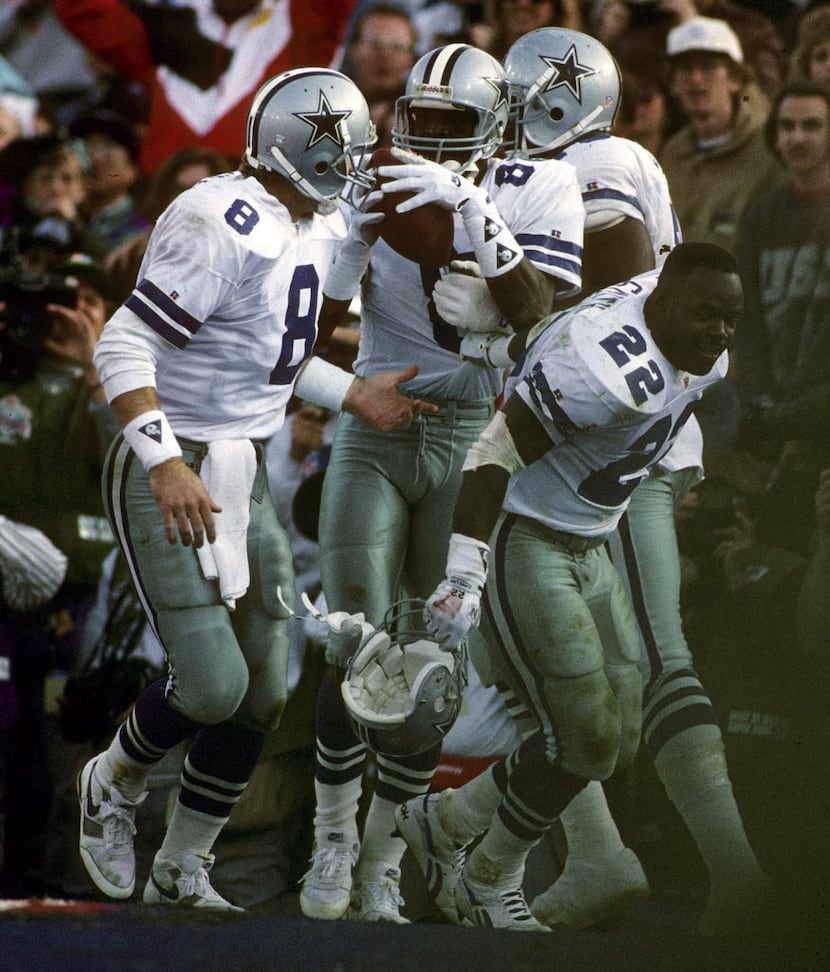 Dallas Cowboys running back Emmitt Smith (22) and Hall of Fame quarterback Troy Aikman (8)...