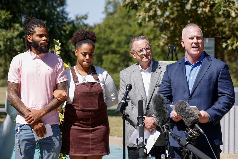 Attorney Brian Hargrove (right) speaks alongside Tariq Williams (left) and Kayla Mitchell...