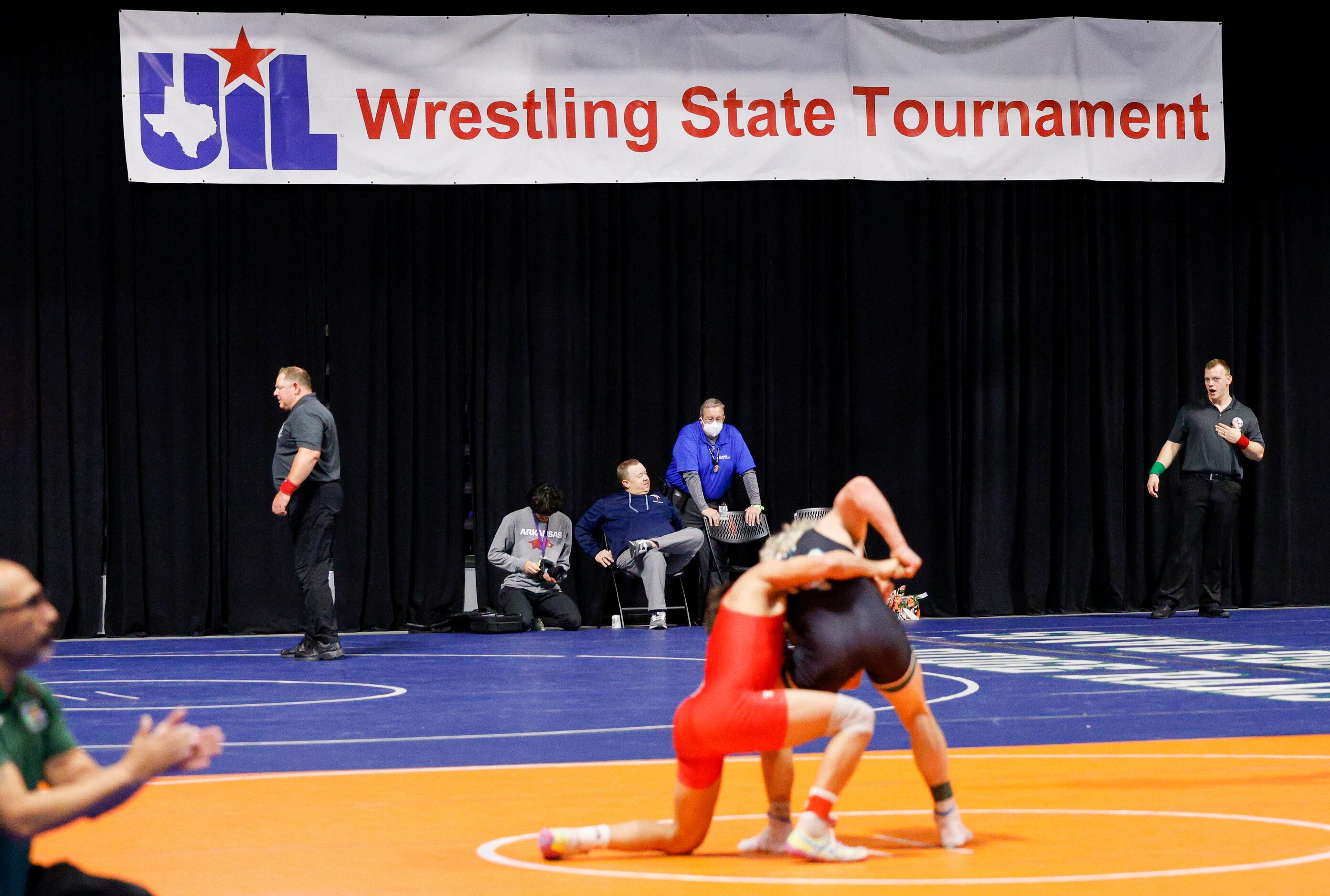 Athletes wrestle during day one of the UIL State Wrestling tournament at the Berry Center on...