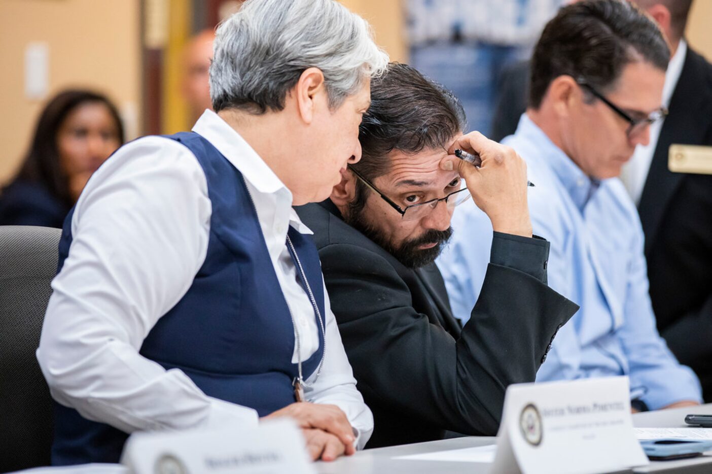 Bishop Daniel Flores confers with Sister Norma Pimentel during a roundtable discussion at...