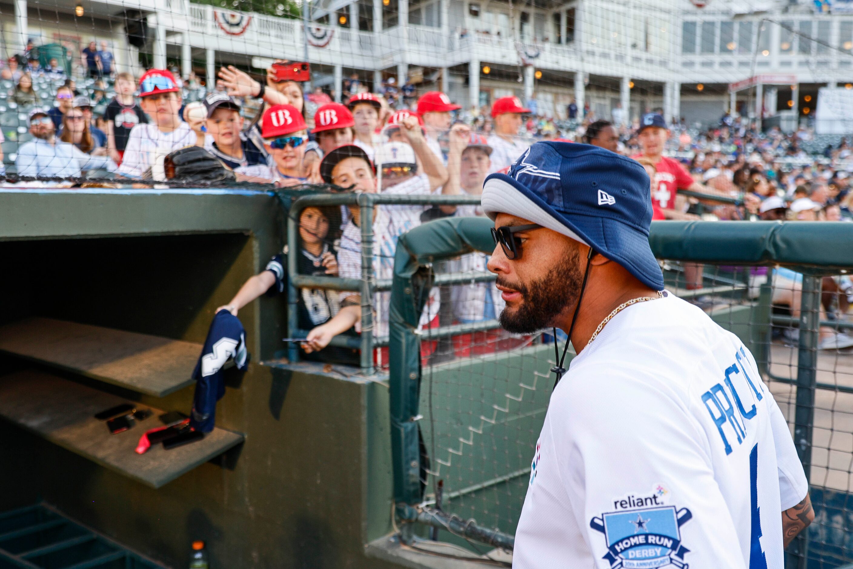 Young fans reach out to receive autograph from Dallas Cowboys QB Dak Prescott during annual...