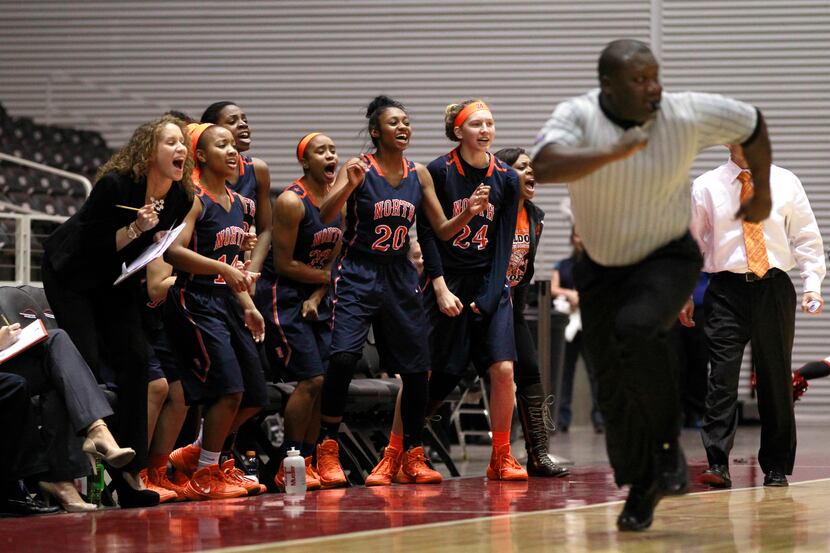 The McKinney North bench reacts as they break up the court in the first half of the Class 4A...