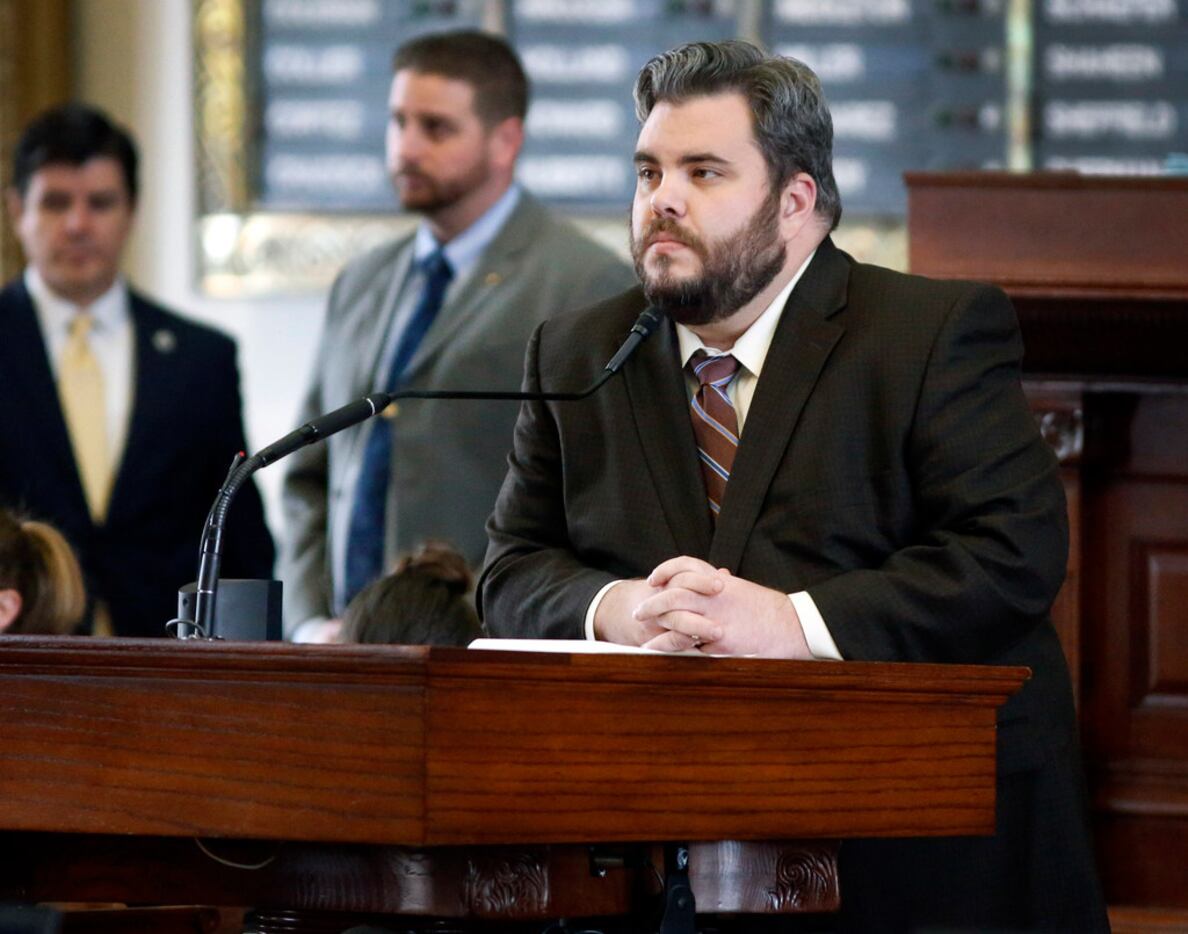 Rep. Jonathan Stickland, R-Bedford, listens to Rep. Celia Israel, D-Austin, speak about her...