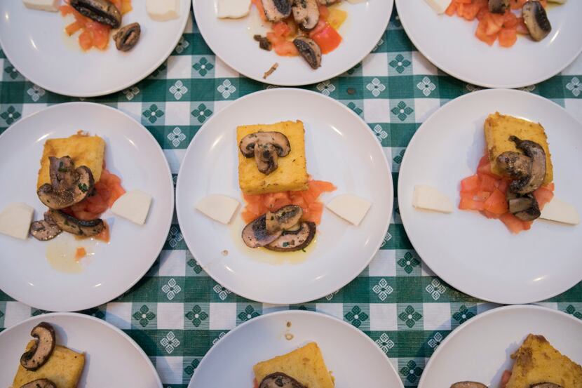 Polenta crostini with mushrooms are plated and ready to serve at the Italian Club of Dallas. 