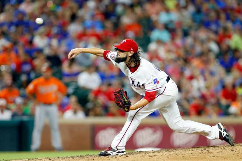 Texas Rangers relief pitcher Tony Barnette (43) throws against the Baltimore Orioles in the...