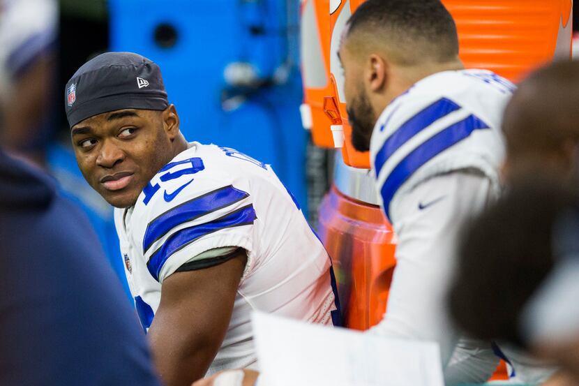 Dallas Cowboys wide receiver Amari Cooper (19) talks with quarterback Dak Prescott (4) on...