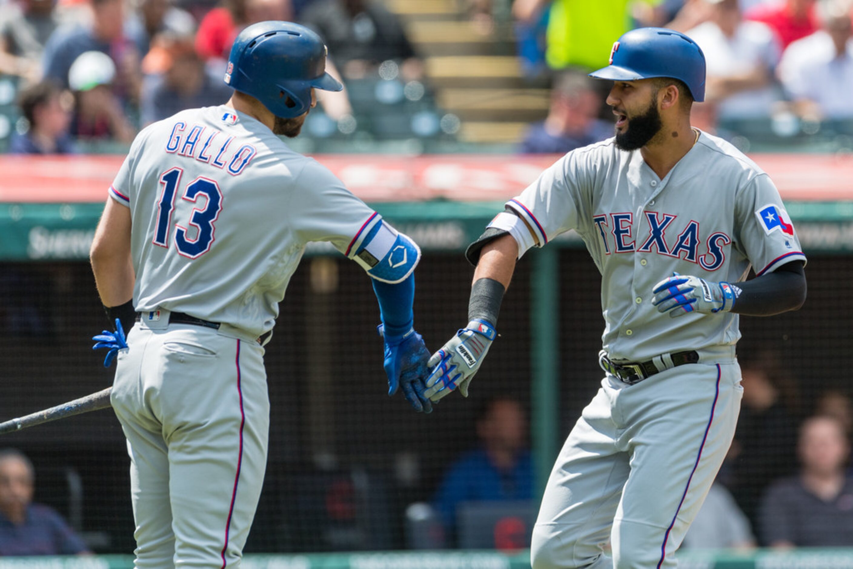 CLEVELAND, OH - MAY 2: Joey Gallo #13 celebrates with Nomar Mazara #30 of the Texas Rangers...