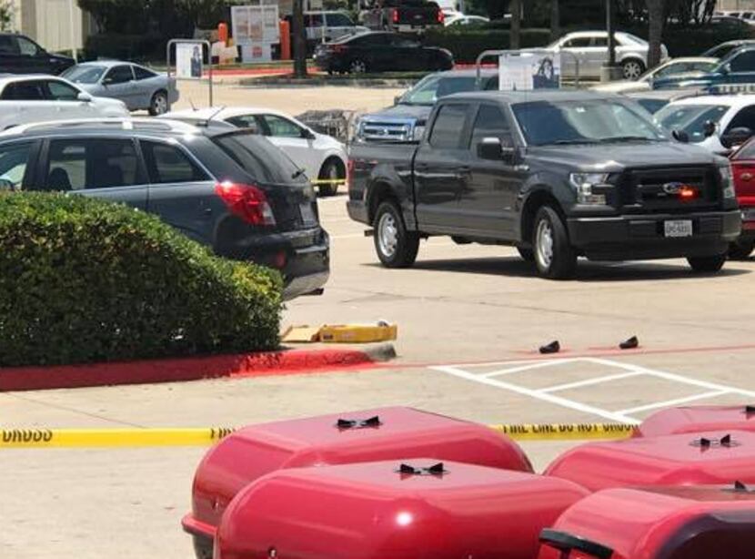 Police say a woman was trapped under an SUV Thursday morning in the Kroger parking lot in...