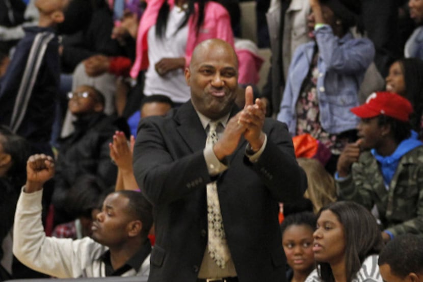 Triple A Academy head coach Timothy Singleton reacts in the first half of the basketball...