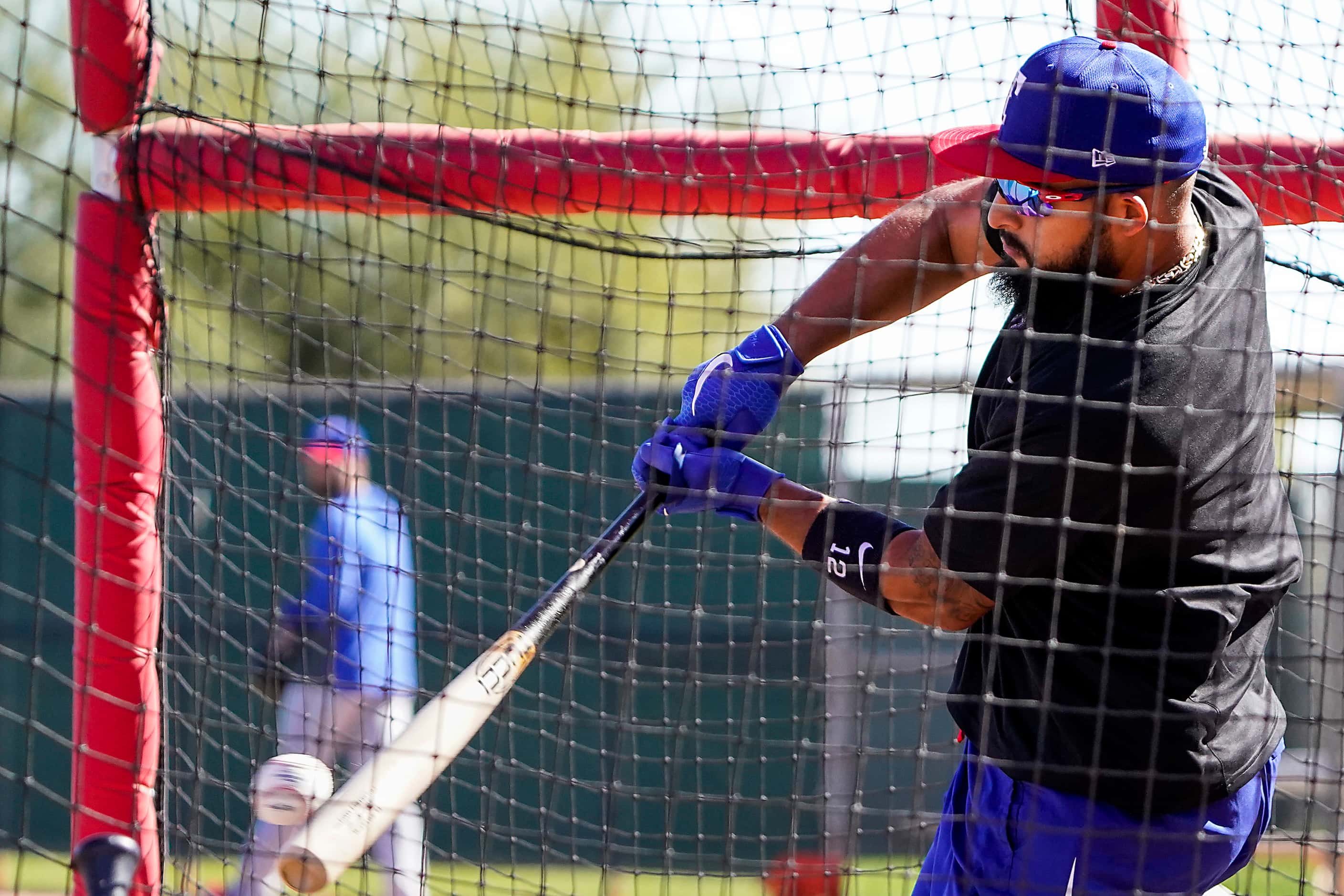 Texas Rangers second baseman Rougned Odor takes batting practice during a spring training...