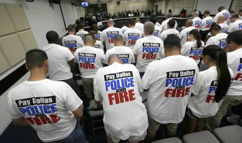 Dallas police and firefighters looking for raises filled the gallery for a City Council...