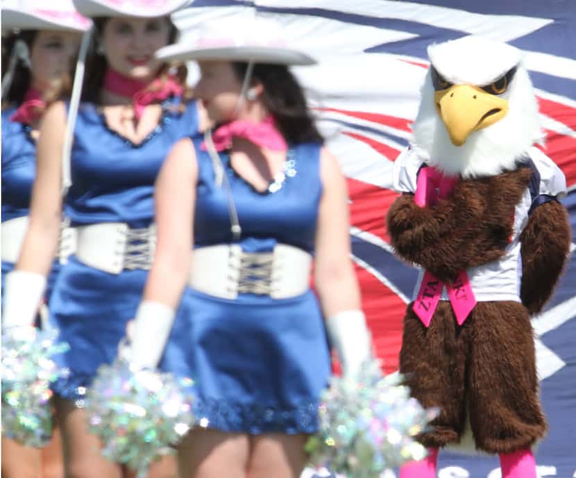 The Allen Eagles mascot pauses and prepares for the playing of the national anthem just...