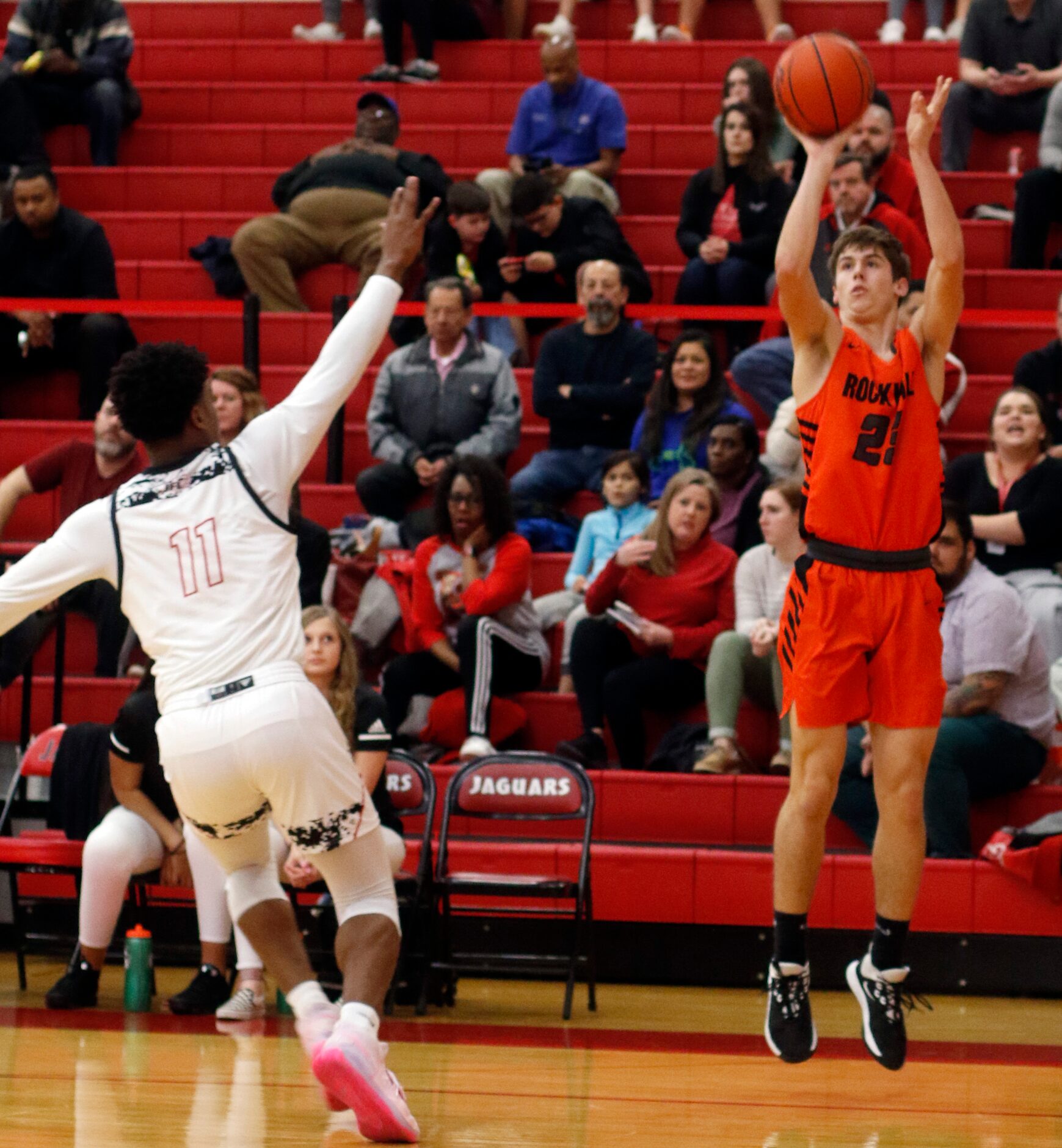 Rockwall's Caden Marshall (23) gets off a long range shot as Mesquite Horn's Zaakir Saywer...