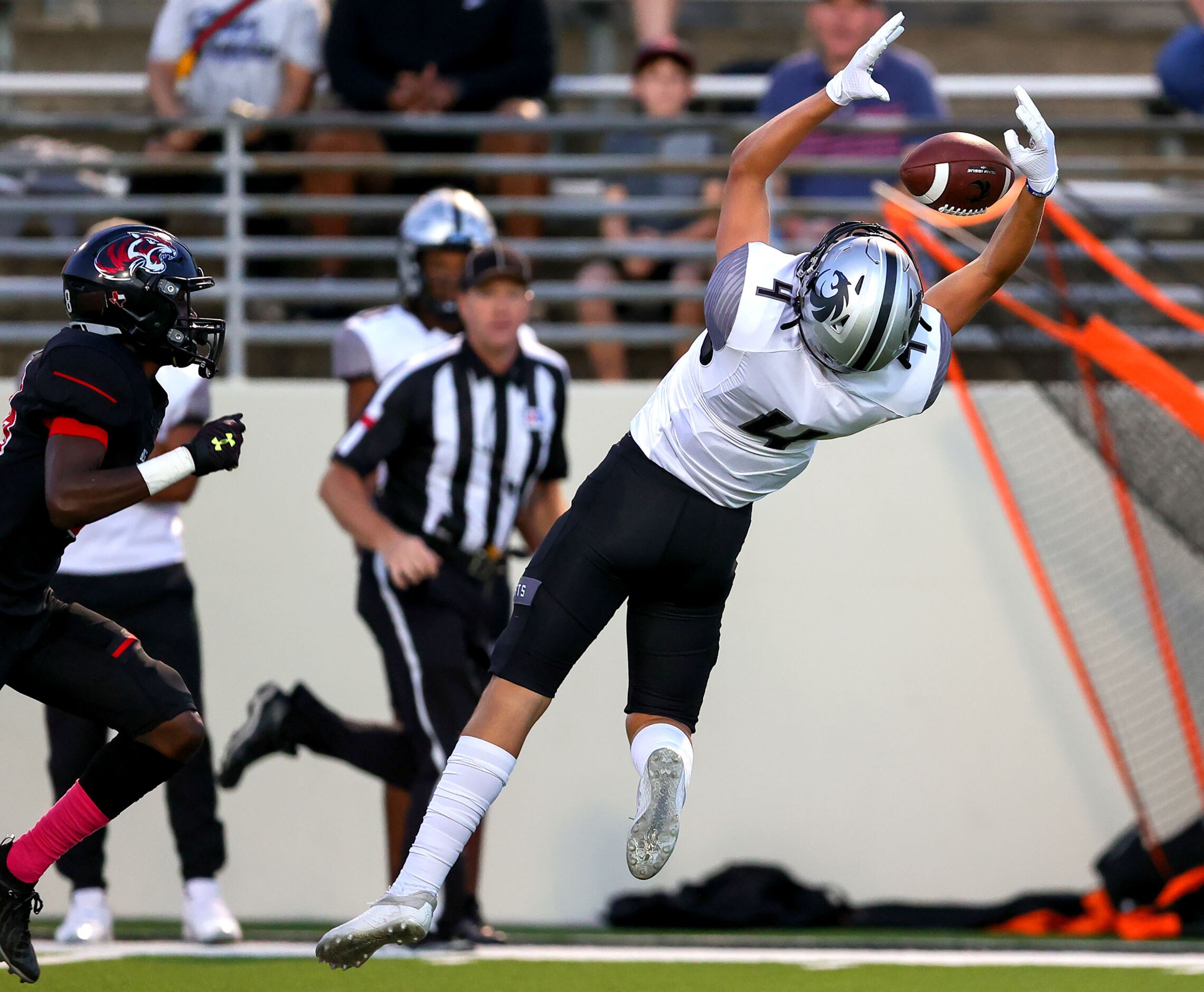 Denton Guyer wide receiver Brody Noble (4) tries to come up with a reception against Denton...