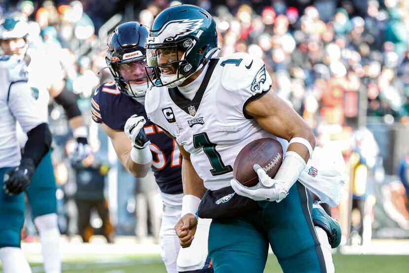 Philadelphia Eagles quarterback Jalen Hurts (1) rushes with the ball against Chicago Bears...