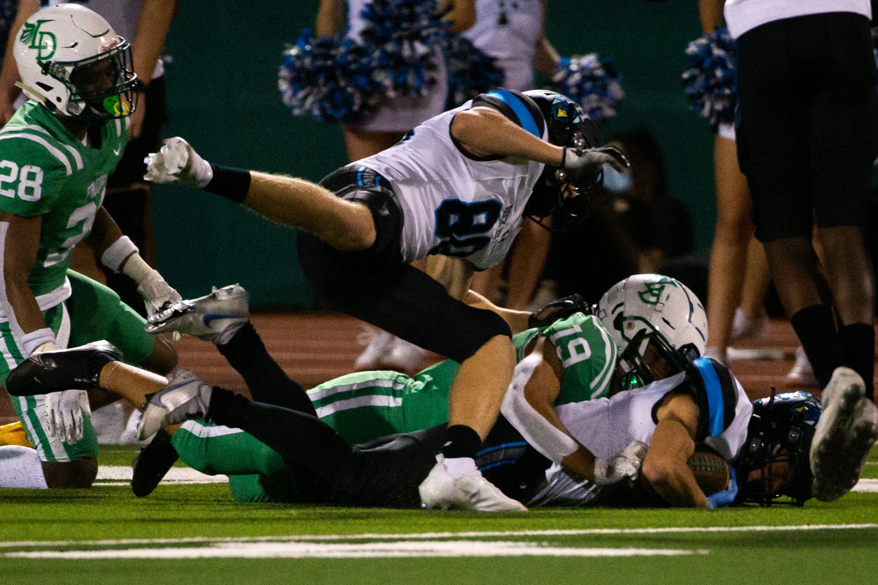 Lake Dallas defensive back Anthony Luna (19) brings down Rock Hill wide receiver Coleman...