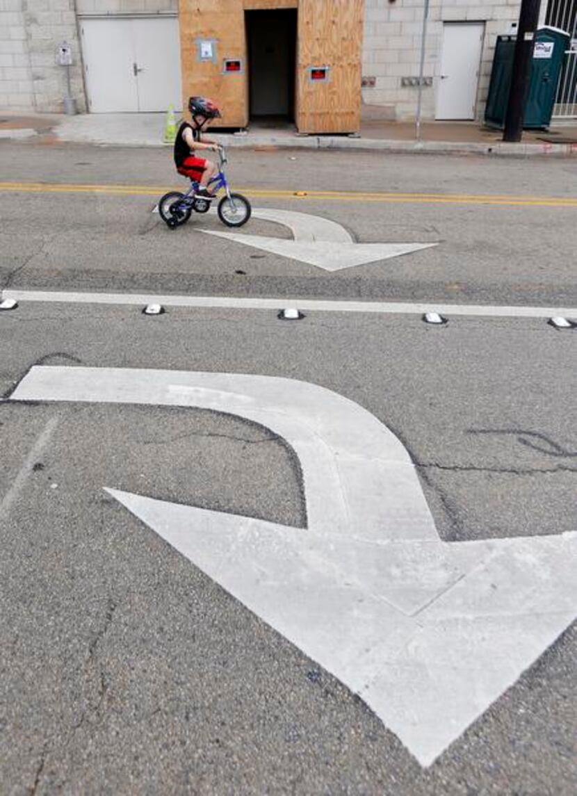 
Gavin Hildebrand, 4, pedaled along Harwood Street during the Uptown Ciclovía, which...