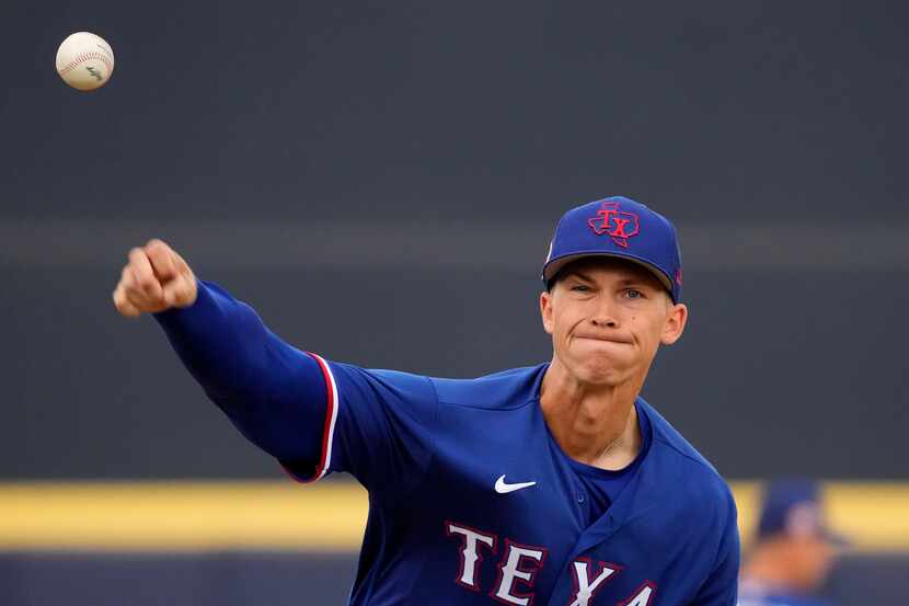 Texas Rangers starting pitcher Glenn Otto throws during the first inning of a spring...