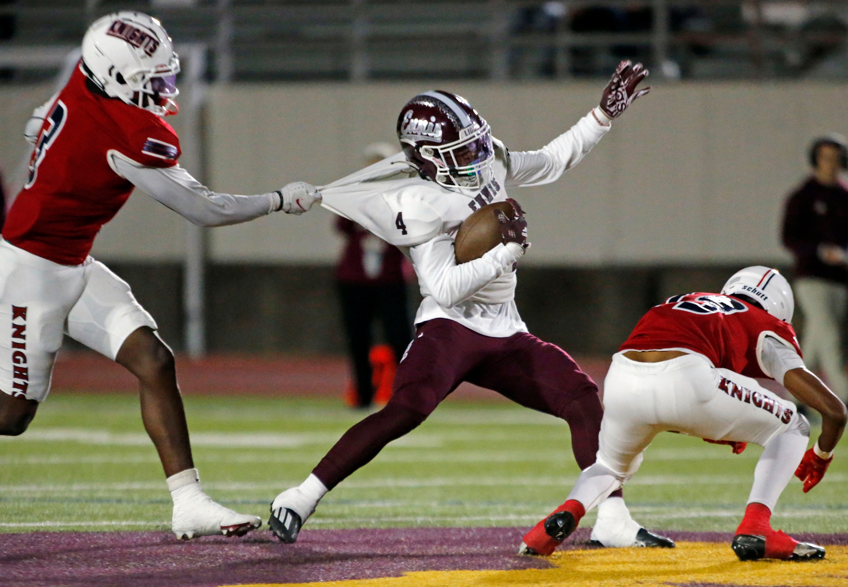 Ennis RB Jeremy Brown Jr. (4) drags Kimball high defender  Dakeriean Johnson (3) for a...