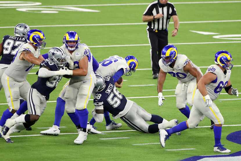 Aldon Smith #58 of the Dallas Cowboys sacks Jared Goff #16 of the Los Angeles Rams during...