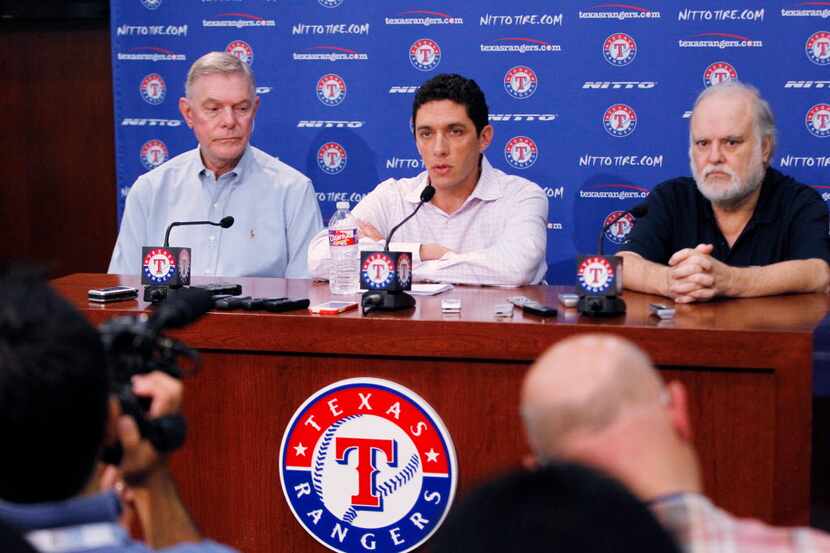 Texas Rangers President and General Manager Jon Daniels, center, speaks during a press...