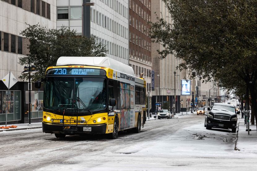What little traffic there was Tuesday moved slowly through downtown Dallas, where ice and...