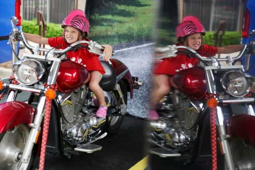 
Sophie Cocita, 5, of Dallas geared up for a motorcycle photo as the Texas Department of...