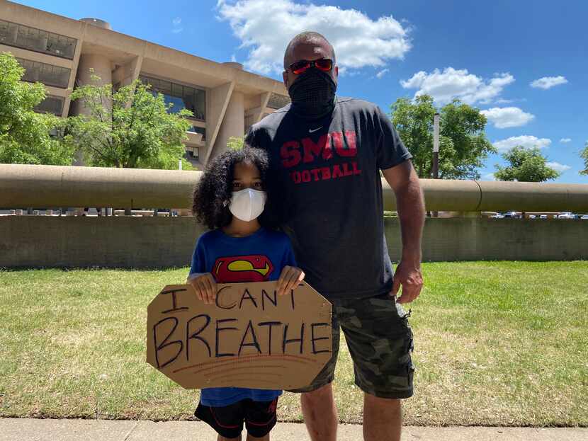 Max Nady (left) and his father Scott Nady protest outside Dallas City Hall on June 5, 2020. 