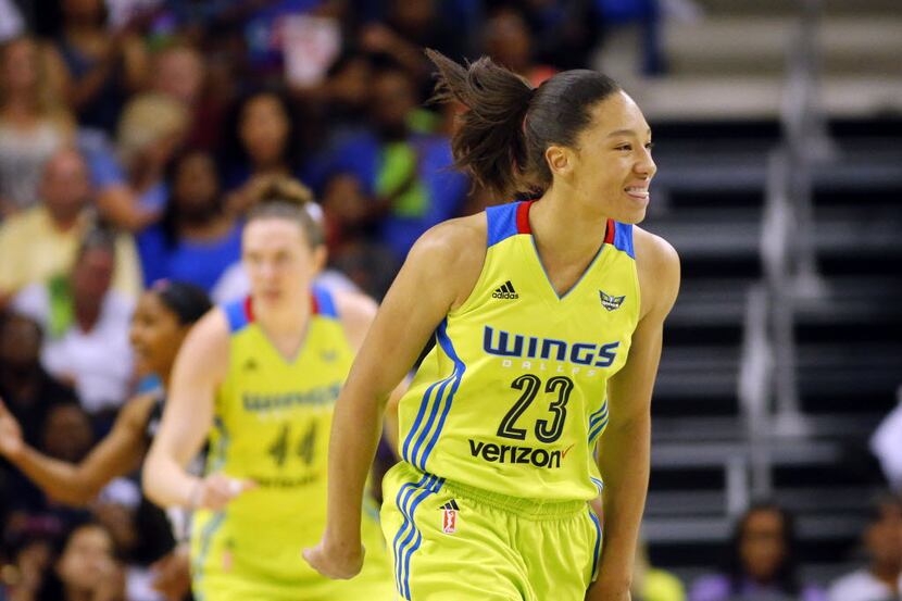 Dallas Wings forward Aerial Powers (23) reacts after hitting a second quarter  shot against...
