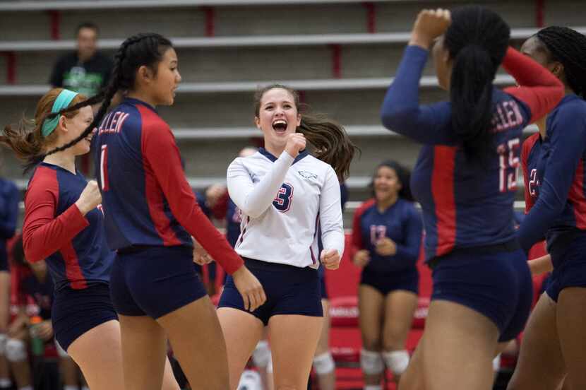 Allen senior libero Shelby Perlich celebrates a point against Southlake Carroll during their...