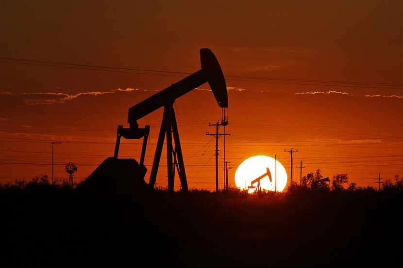 A pump jack operates in an oil field in the Permian Basin in Texas on June 11, 2019. (Jacob...