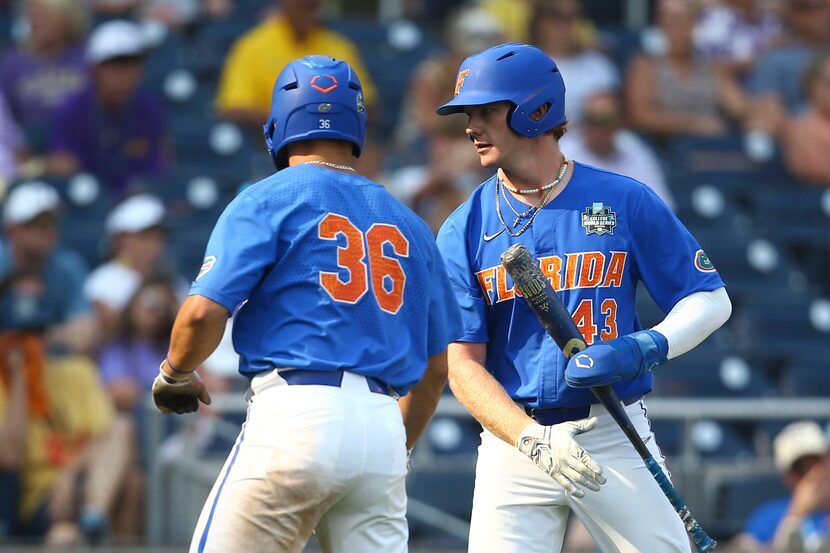 Florida's Matt Prevesk (43) is greeted by Wyatt Langford (36) after scoring during the 9th...