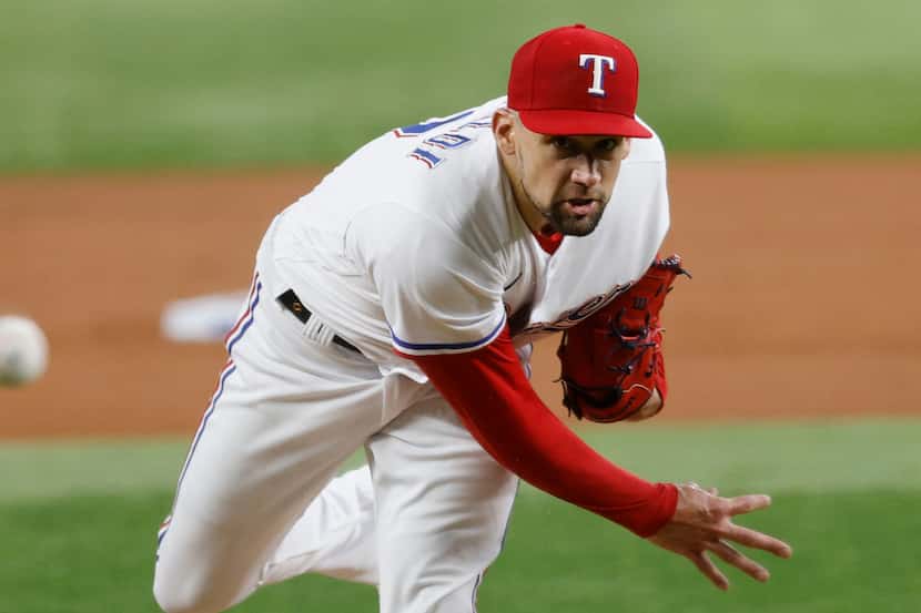 Texas Rangers pitcher Nathan Eovaldi delivers during the first inning of a baseball game...