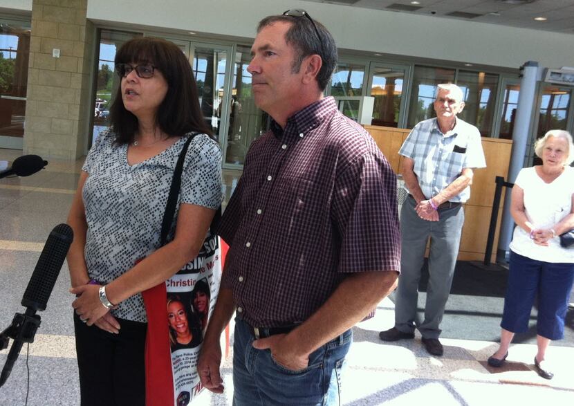 Parents Anna and Mark Morris answer questions from the media after a June hearing at the...