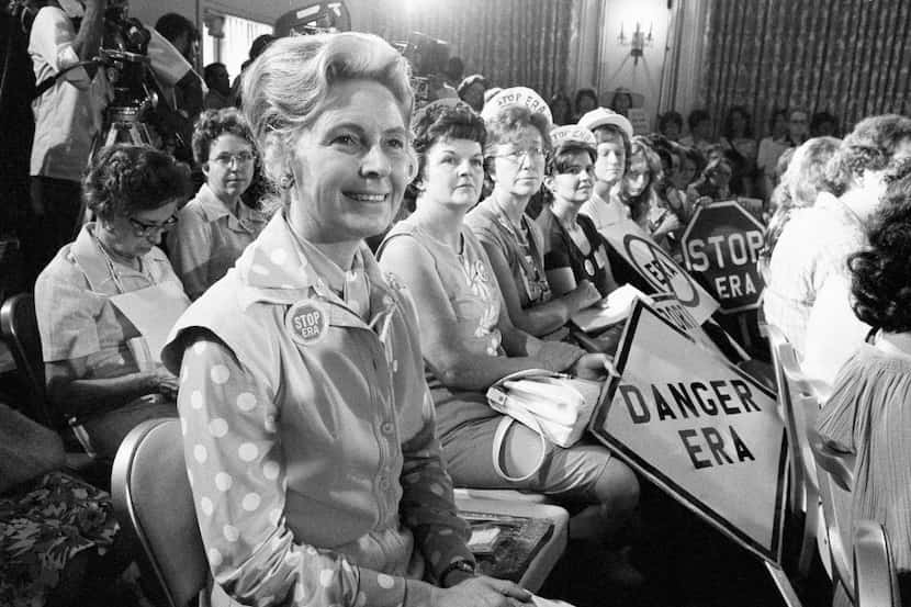 In this Aug. 10, 1976, file photo, women opposed to the Equal Rights Amendment sit with...