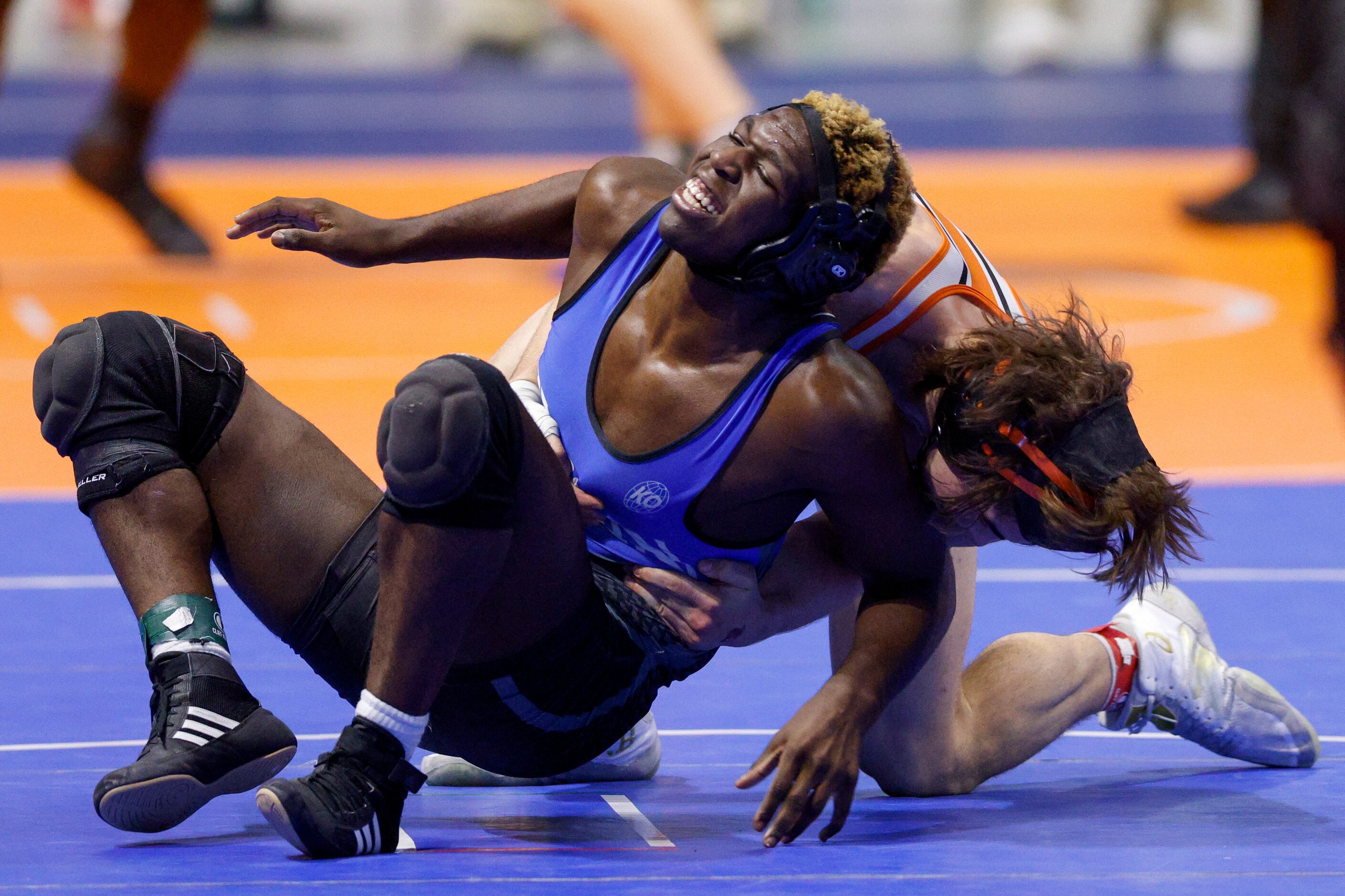 Logan Mantezolo of Trophy Club Bryon Nelson (left) wrestles Jarrett Stoner of Rockwall...