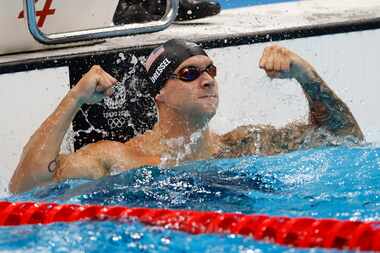 USA’s Caeleb Dressel celebrates after winning the men’s 50 meter freestyle final during the...